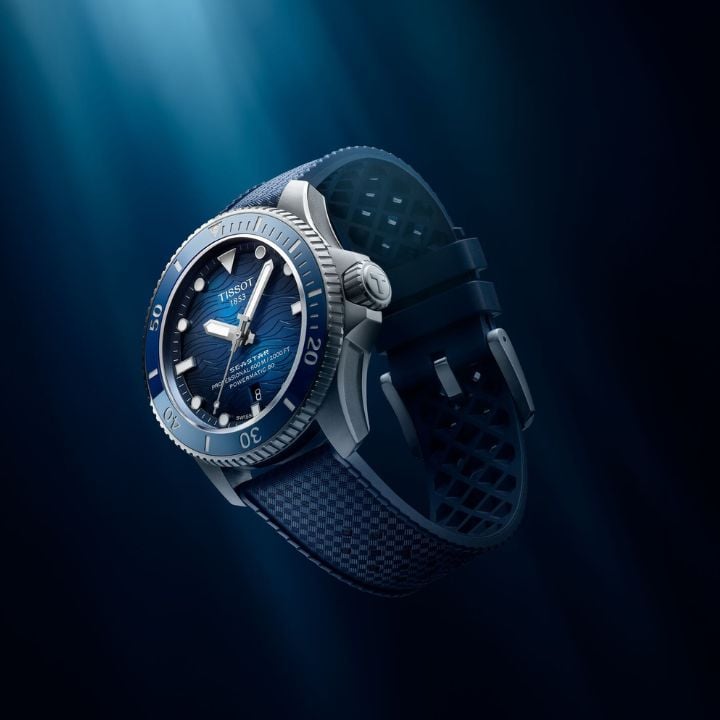 Angled black and gold watch in water